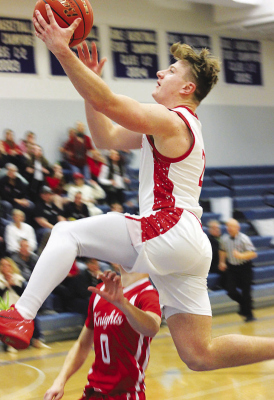 Card senior Parker Borer flies past a Norfolk Catholic defender during the Mid-State Conference championship game Saturday. (Sydney Patzel/Karla Patzel)