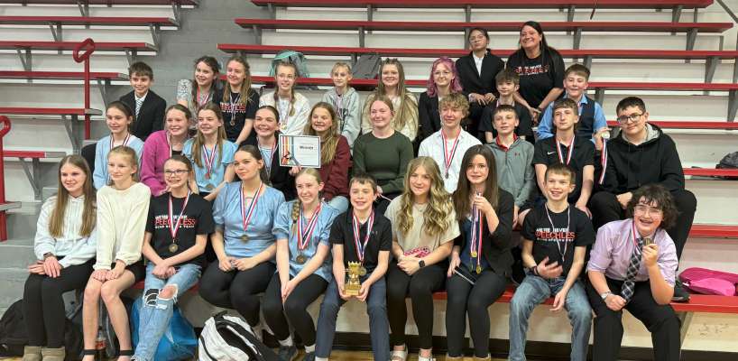 The Cardinal team with their overall trophy and medals.