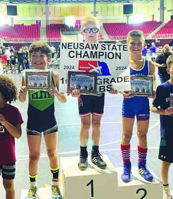 Boone Central’s Luke Edwards (center) was a champion in the 2024 Nebraska USA Wrestling State Tournament. Edwards won the 1st-2nd grade 65 lb. division with a 5-0 record (all pins). Edwards was one of 10 Cardinal youth competing in the state tournament. Nathan Hemmingsen placed third in the 5th-6th grade 90 lb. division and Julia Molt was fourth in the girls PreK-K 52-55 lb. group. (Submitted photo)