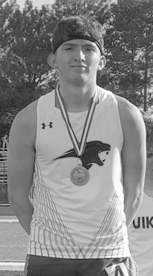 Micah Cuevas with his 3rd place medal in the 1600 meter run from the Central NE Track Championships