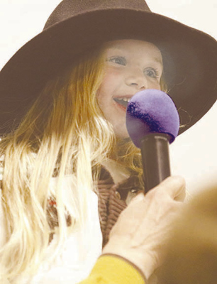 NATIONAL ANTHEM SINGER -- Four-year-old Wyleigh Peters provided an early highlight by singing the National Anthem at the annual Gateway to the Sandhills Bullride last Saturday night.