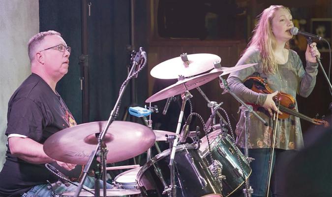 FULL CHOKE PERFORMS -- Country music and dancing were featured when Full Choke performed at the Niewohner Arena on the Boone County Fairgrounds Saturday night. About 200 people attended.