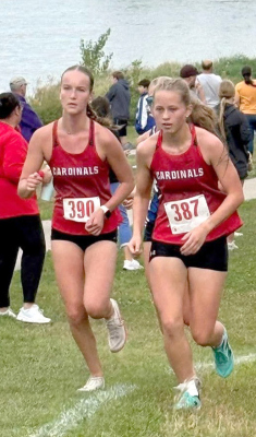 Johnna Spence and Leah Erickson work together on the tough Skyview Lake course. The Cardinals earned the runner up spot in the team standings.