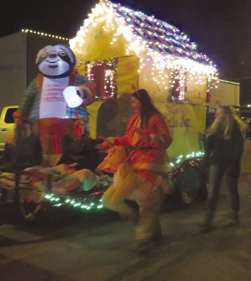 GINGERBREAD HOUSES like this one were popular decorating themes for the Holiday Light Parade.
