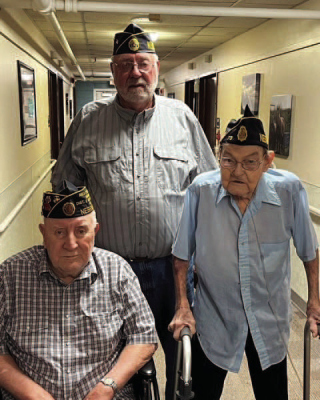 Newman Grove American Legion Post 72 honored three servicemen with years of service recognition, marking their 70th, 60th and 50th consecutive years of service to the community and Post #72. At front, right, was Elliott Broberg with 70 years, U.S. Navy, Korean War; Jerry Lyon is pictured front left with 60 years, U.S. Marine Corps, Vietnam era; and standing is Kenny Stone with 50 years, U.S. Army, Vietnam era.