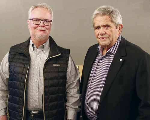 RETIREMENT OPEN HOUSE for Doug Young, l., vice president and manager at Cornerstone Bank, last Friday included a visit by Kelly Holthus of York, r., president of Cornerstone Bank.