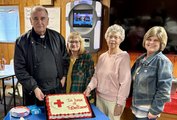 Pictured with Father Baumert are coordinators JoAnn Mattner and Kathy Koch and Antelope Boone County Club member Bonnie Wies.