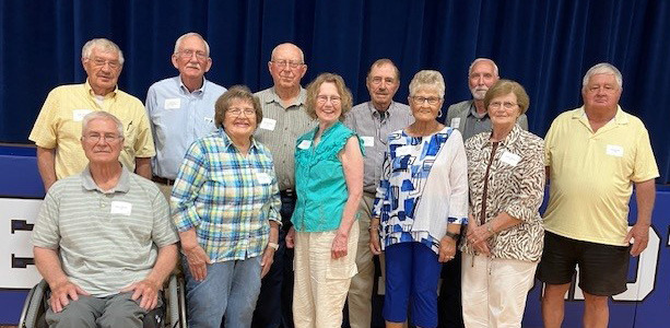 Newman Grove Class of 1965, front row (l to r): Milan Sawyer; Ruth Boettcher; Beverly Ben-son Evans; Joyce Flood Vosteen; Deann Hallgren Nelson; back row (l to r): Gale Schafer; Richard Christensen; Alan Wedekind; Lynn John Buhl; Geroge Kopecky and Darrell Bhul.