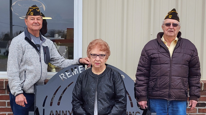 Larry Swerczek, Jeanne Young and Bill Wieser with the bench Jeanne donated in honor of her husband Lanny. 