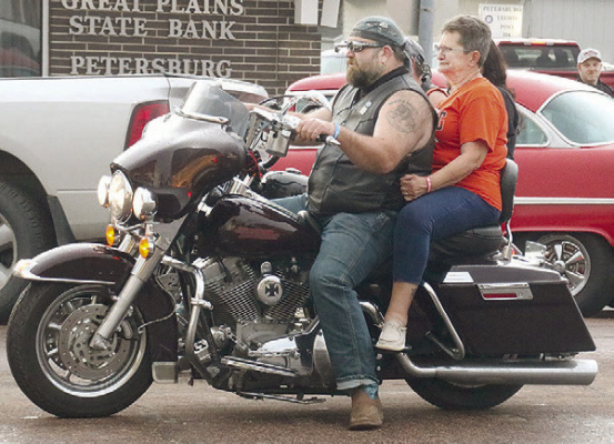 TOP---Participant in the Poker Run; (below) DJ Alan Temme. Jim Dickerson Petersburg Press