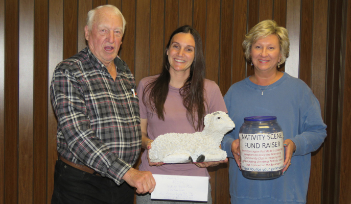 Hank Thieman and Auxiliary member Connie Stuhr presented a check for $650 to PCC president Danielle Koch toward the purchase of a community nativi-ty set. Money was collected in a donation jar during the Lenton fish fry’s with matching funds from the Petersburg American Legion Post 334 and it’s Auxiliary along with funds from Sons of the American Legion