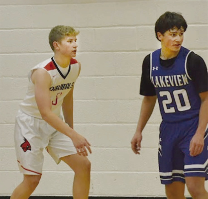 BOONE CENTRAL’S Riley Nelson lines up against a Columbus Lakeview opponent in the Cardinal JV home opener on Dec. 5. Photo couresy of Boone Central Yearbook