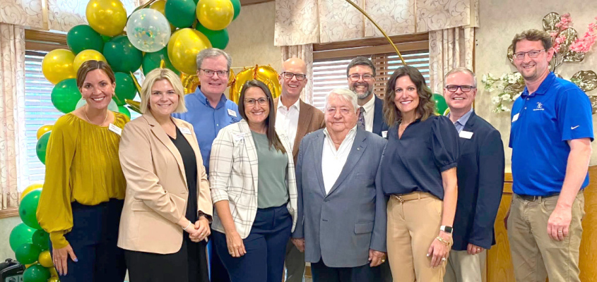 Jack Vetter stands with Cloverlodge staff for a photo