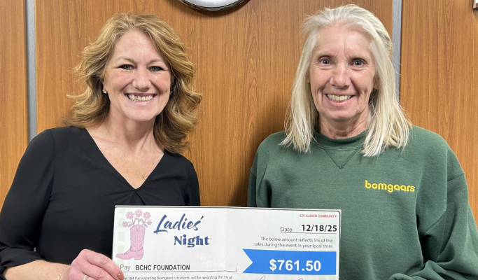 Cindy Bolin, General Manager of the Albion Bomgaars location, presents a donation check to Sarah Grape, BCHC Foundation Director.