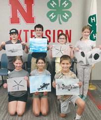 WILDLIFE ARTS -- These 4-H members created fossil prints at the summer Wildlife Arts workshop.