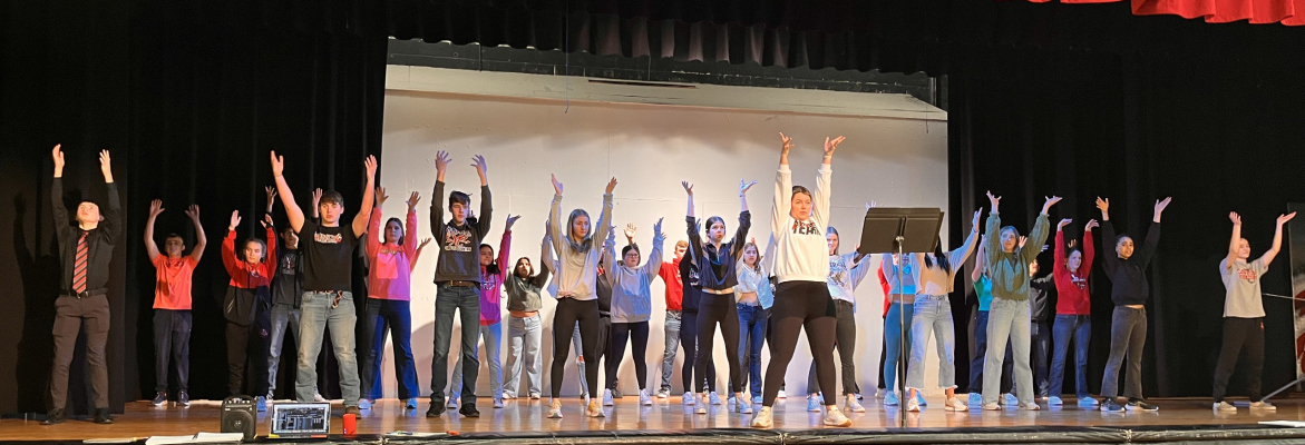Cast members work with choreographer, Brittany Childress on one of the dance number for this year’s musical, “Curtains.”