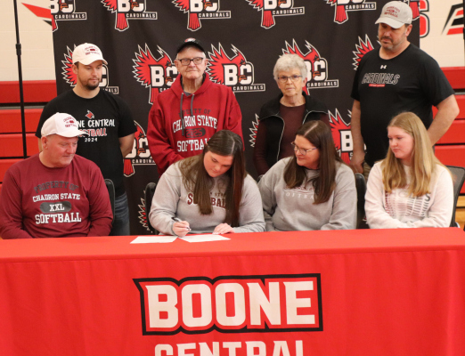 Payton Sullivan (center left) officially signed her “letter of intent” to attend Chadron State and play softball for the Chadron Eagles next season. She is pictured with her dad, Tom Sullivan; her mom, Yetta Sullivan; her sibling, Quinn; Boone Central Coach Miles Ray, Grandpa Gene Sullivan, Grandma Mary Urwin, and Coach Dan Zoucha. Photo courtesy Joel Sup, Boone Central