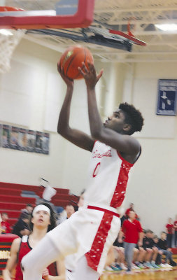 Card senior Jaxon Lipker sails in for a basket during C1-8 Sub-District action at Boone Central last week. (Patzel photo)
