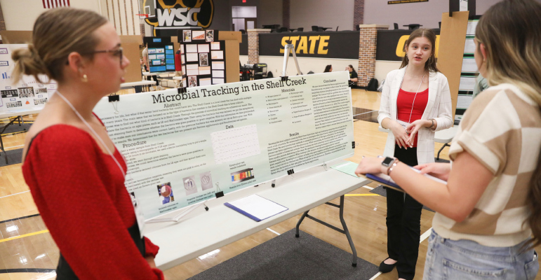 Maddy Wiese (foreground) and Jayden Benson of Newman Grove Junior/Senior High School make their science project presentation “Microbial Tracking in the Shell Creek” during the Northeast Regional Science Fair held March 28 at Wayne State College. Their project was one of 16 that qualified for the Nebraska Junior Academy of Science’s State Science Fair being held April 24.