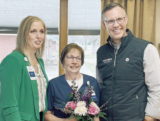 LEADER AWARD -- Leanne Atwood (center) with GSS-Albion Administrator Gina Rankin receiving the award from GSS President/CEO Nate Schema.