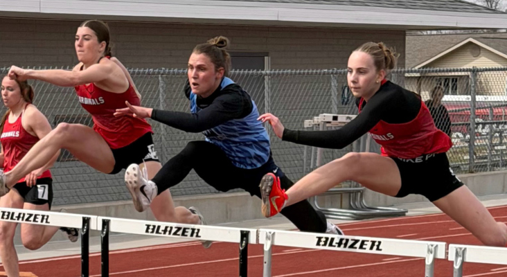 Three of Nebraska’s better high hurdlers locked horns at the Mansfield Invitational. Addy Hedlund, left, and Sophie Lyon, right, surround Sheridan Falk (who won the race) of Nebraska Christian. Sheridan, who won the Class D state title last season, is the granddaughter of Carol and Ron Falk of Albion.