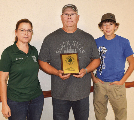 FRIEND OF 4-H -- Randy Pelster of Petersburg (center), received the 2024 Boone County 4-H Supporter Award presented by the Boone County 4-H Council. Wiith Randy were his wife Brenda and son Kahnen.