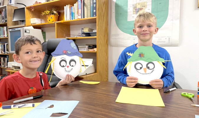 Tucker and Cooper display their scarecrow artwork at the October Petersburg Library Story hour. Both were brought in by their grandmothers