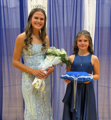 Queen Kaitey Schumacher with crown bearer, Adalyn Veik