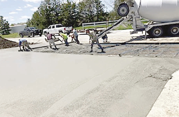 NEW CONCRETE driveway being poured at the Boone County Historical Museum earlier this spring.