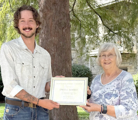 Owen Kimble and Mrs. Jan Cruise – who presented Owen with the scholarship check and certificate on 08/21/2025.