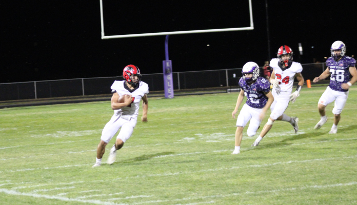 #7 Brogan Benes seeks to avoid Wood River defenders. Photos by BC Yearbook staff.
