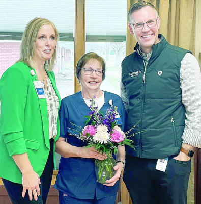 NATIONAL AWARD -- Leanne Atwood (center) with GSS-Albion Administrator Gina Rankin and GSS President/CEO Nate Schema after receiving her award.
