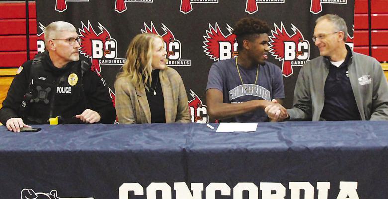Lipker inks Letter of Intent with Concordia University track/field program Boone Central senior Jaxon Lipker put pen to paper and made his commitment to the Concordia University track/ field program Jan. 17 at the Boone Central performance gymnasium. Above, Lipker is welcomed by Concordia track/ field coach Matt Beisel with parents Brent and Tracy Lipker looking on. (Photo, Joel Sup, Boone Central Schools)