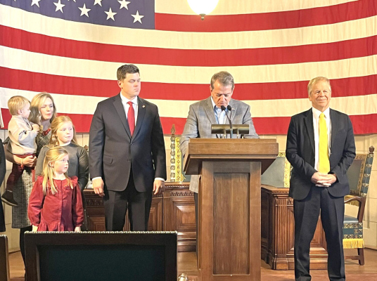 Treasurer Tom Briese of Albion (at right) with Gov. Jim Pillen and new state treasurer, Joey Spellerberg and family (at left).