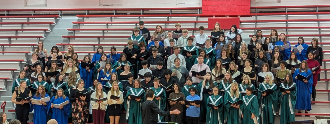 The combined choir under the direction of Elizabeth Johnson, accompanied by Leta Liesch.