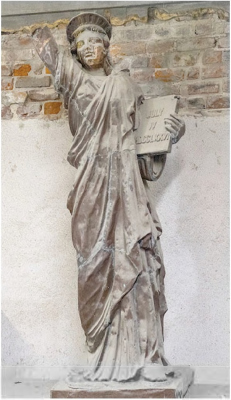 John Lajba’s downtown Omaha studio houses an old replica Statue of Liberty, known as a Little Sister of Liberty. Photo: Joseph Saaid for Flatwater Free Press
