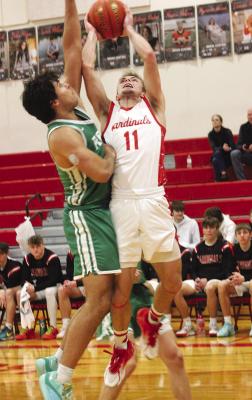 Cardinal senior Brant Benes (11) goes up strong for a score, helping Boone Central defeat visiting Scotus 59-30 Friday. (Photo, Karla Patzel)