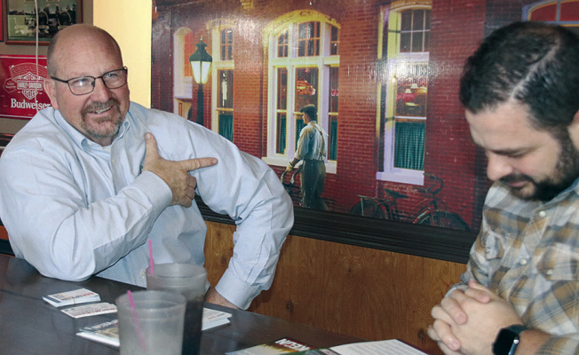 District 41 candidate Dan McKeon, l., visits with Boone County Health Center CEO and President Caleb Poore on Saturday.