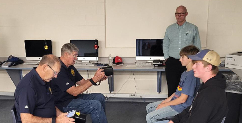 Lions Club members operating Visual Scanning equipment.