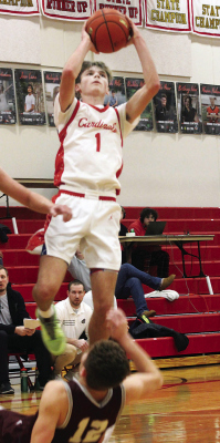 Connor Christo charges to the hoop for two points during Boone Central’s victory over Crofton in the first round of the Mid-State Conference tournament. (Sydney Patzel/Karla Patzel)