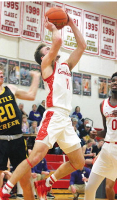 Card senior Brant Benes makes an aggressive move to the basket in Boone Central’s 59-56 win over Battle Creek Friday. (Photo, Karla Patzel )