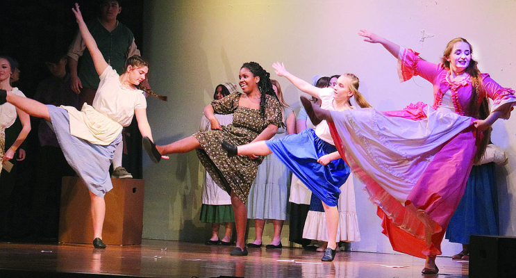 LADIES of the village dance to celebrate the announcement: “The Prince is Having a Ball!”