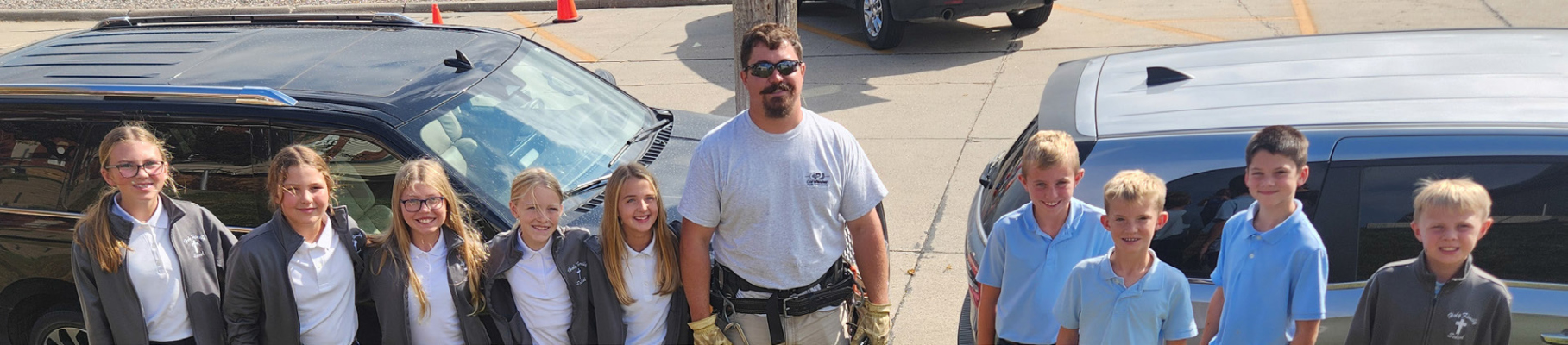 Line Technician Jon Ramaekers with fifth grade students from Lindsay Holy Family.