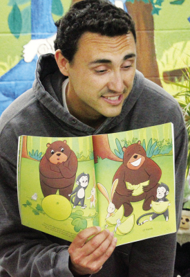 AUTHOR Brody Kelley reads form his book, “The BEST,” to children at the Albion Public Library last Saturday afternoon