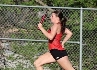 Relays are important to any teams success. Here Addyson Hedlund flies down the backstretch on the second leg of the winning and state qualifying 4x100 relay.