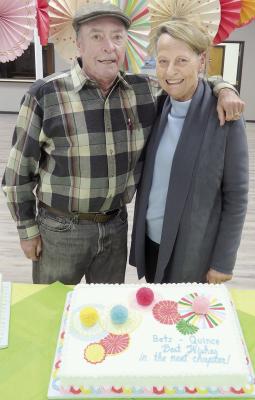 RETIREMENT CELEBRATION -- Doc and Betz Quincy were honored by many area residents at their retirement celebration last Tuesday, Jan. 16, at the Newman Grove Community Center. They are shown with a special cake created in their honor by Deanna Lilja.