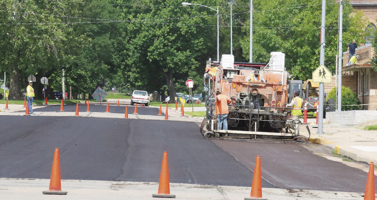 MICROSURFACING STREETS -- Sta-Bilt Construction was in Albion last Friday to install the microsurfacing of city streets. Nearly 40 blocks were completed. The company plans to return next summer to coat about 25 more blocks.