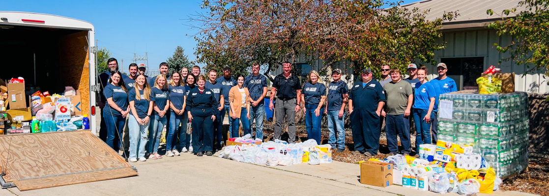 Employees and representatives for Applied Connective and Valero with the food they cumulatively gathered.